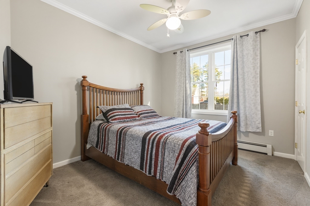 204 Brookfield Road Charlton, MA 01507 - Photo 24 of 36 a bed room with a bed and a television
