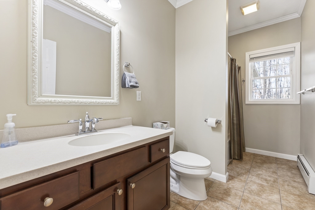 204 Brookfield Road Charlton, MA 01507 - Photo 26 of 36 a bathroom with a sink a toilet and a mirror