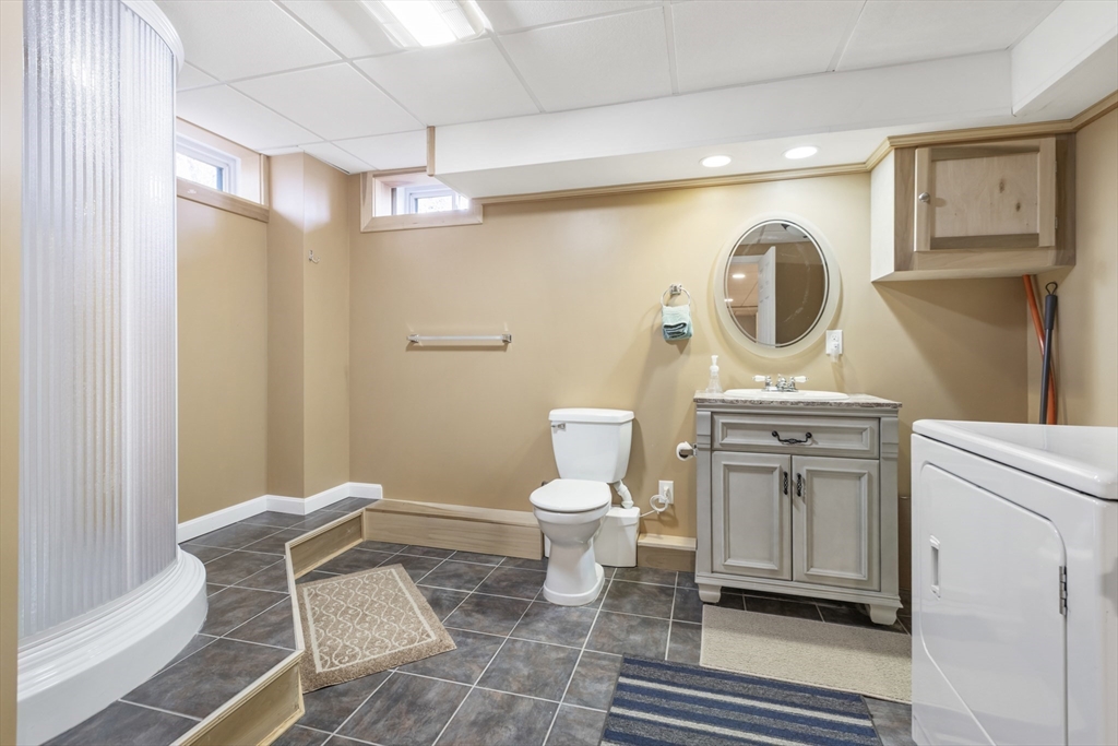 204 Brookfield Road Charlton, MA 01507 - Photo 32 of 36 a bathroom with a toilet sink and mirror