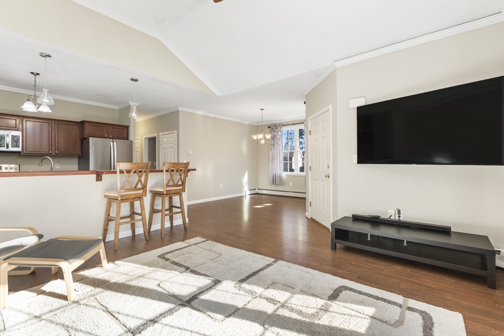204 Brookfield Road Charlton, MA 01507 - Photo 9 of 36 a living room with furniture and a flat screen tv