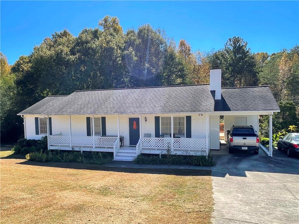 4205 Jim Hood Road Gainesville, GA 30506 - Photo 1 of 1 a front view of a house with a yard tree and a large window