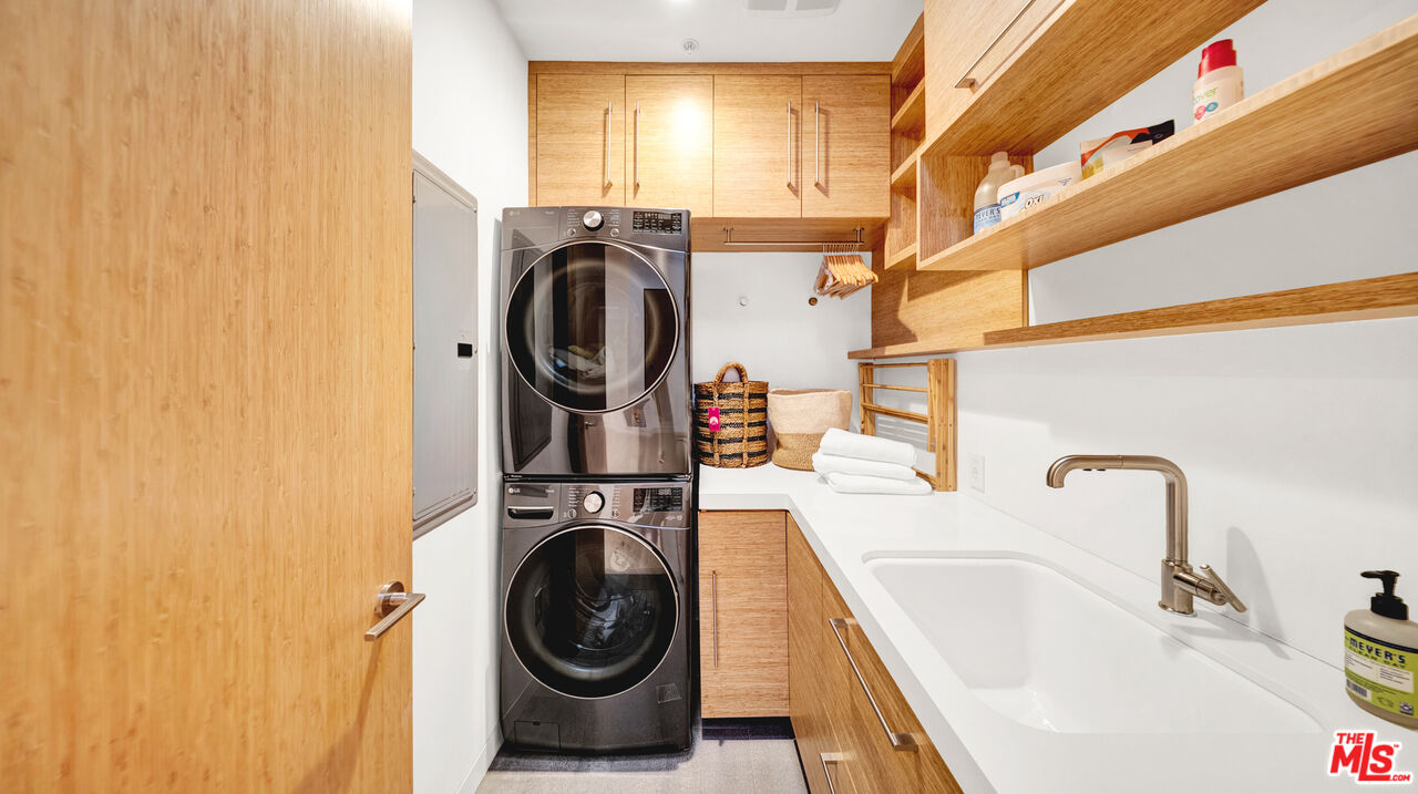 2915 Tuna Canyon Road Topanga, CA 90290 - Photo 34 of 45 a utility room with sink dryer and washer