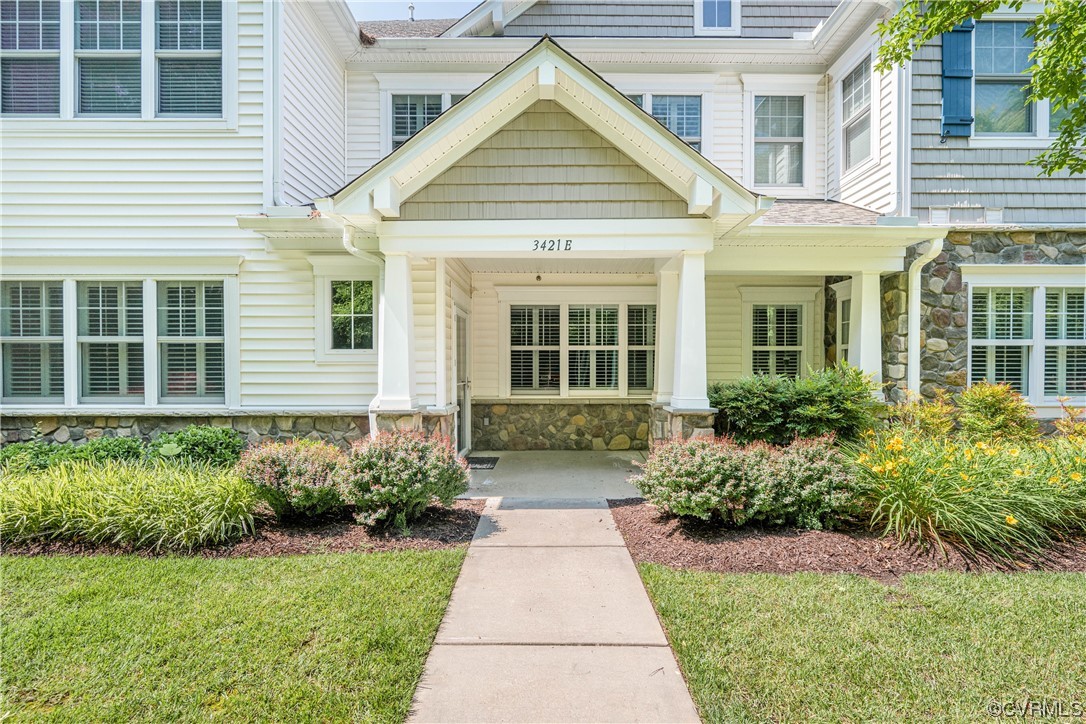 3421 Coles Point Way, Unit E Glen Allen, VA 23060 - Photo 1 of 28 a front view of a house with garden