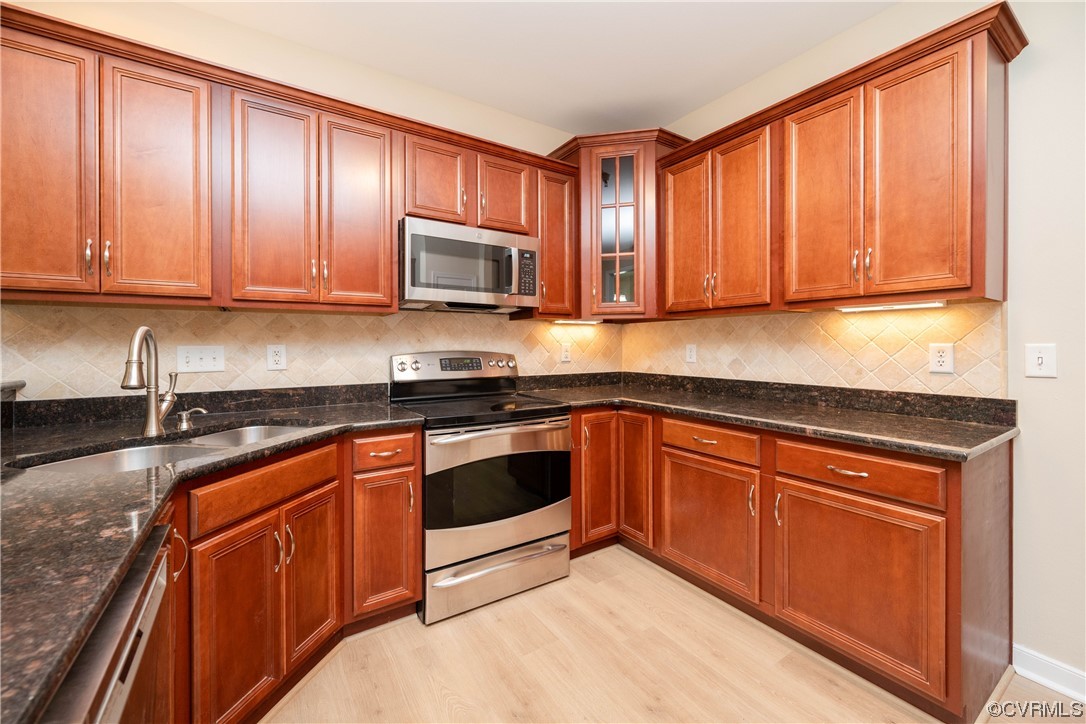 3421 Coles Point Way, Unit E Glen Allen, VA 23060 - Photo 13 of 28 a kitchen with granite countertop wooden cabinets stainless steel appliances a sink and a window