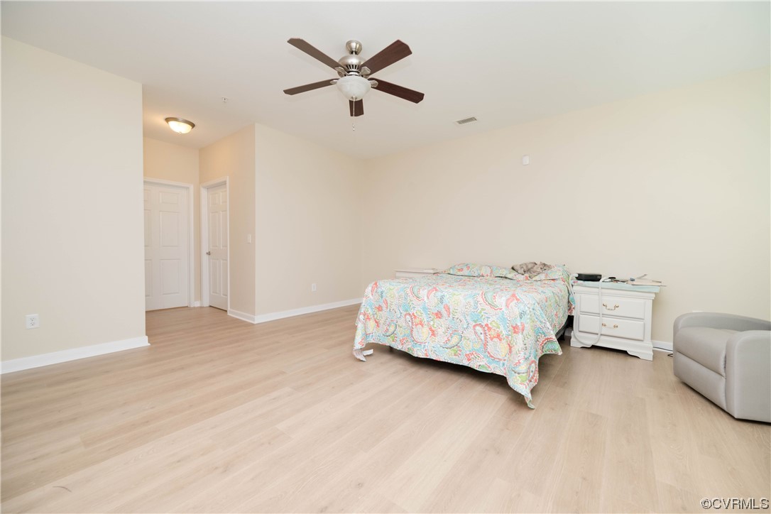 3421 Coles Point Way, Unit E Glen Allen, VA 23060 - Photo 16 of 28 a bedroom with a bed and a couch