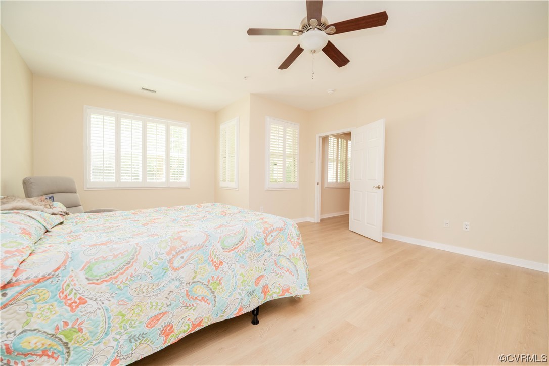 3421 Coles Point Way, Unit E Glen Allen, VA 23060 - Photo 17 of 28 a spacious bedroom with a bed and a window