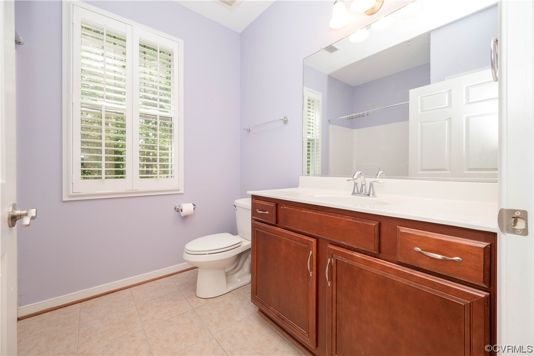 3421 Coles Point Way, Unit E Glen Allen, VA 23060 - Photo 24 of 28 a bathroom with a toilet sink and a window