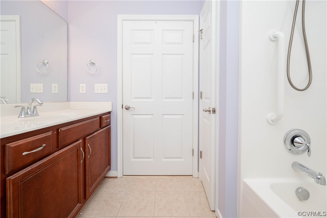 3421 Coles Point Way, Unit E Glen Allen, VA 23060 - Photo 25 of 28 a bathroom with a sink and a mirror