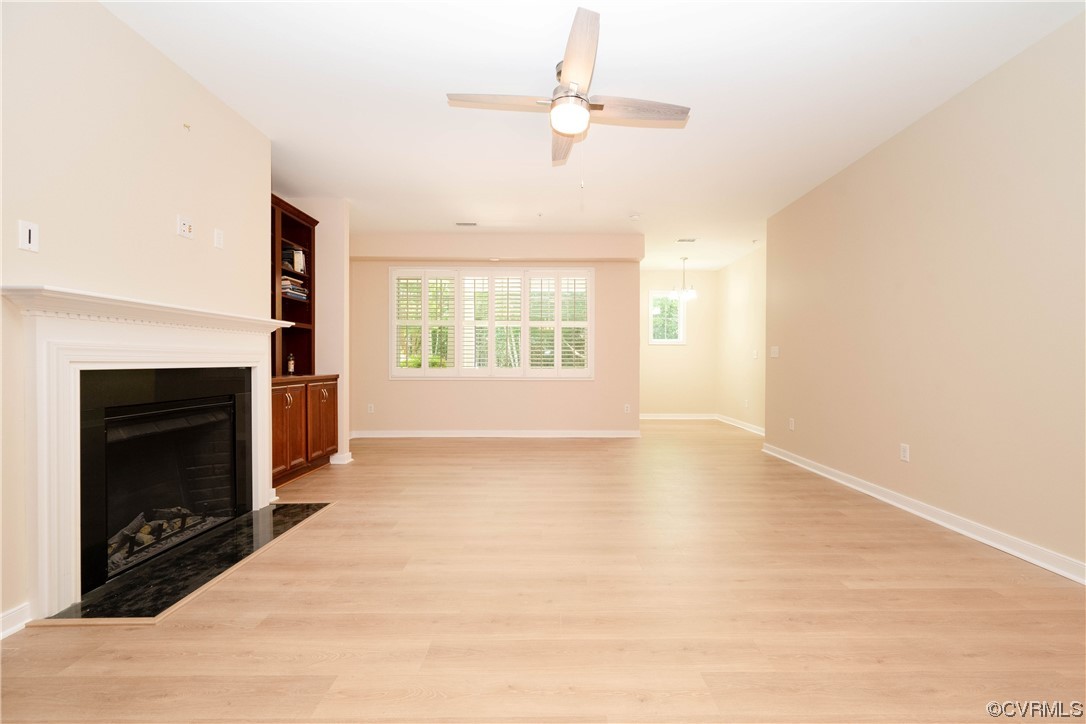 3421 Coles Point Way, Unit E Glen Allen, VA 23060 - Photo 7 of 28 a view of an empty room with a fireplace and a window