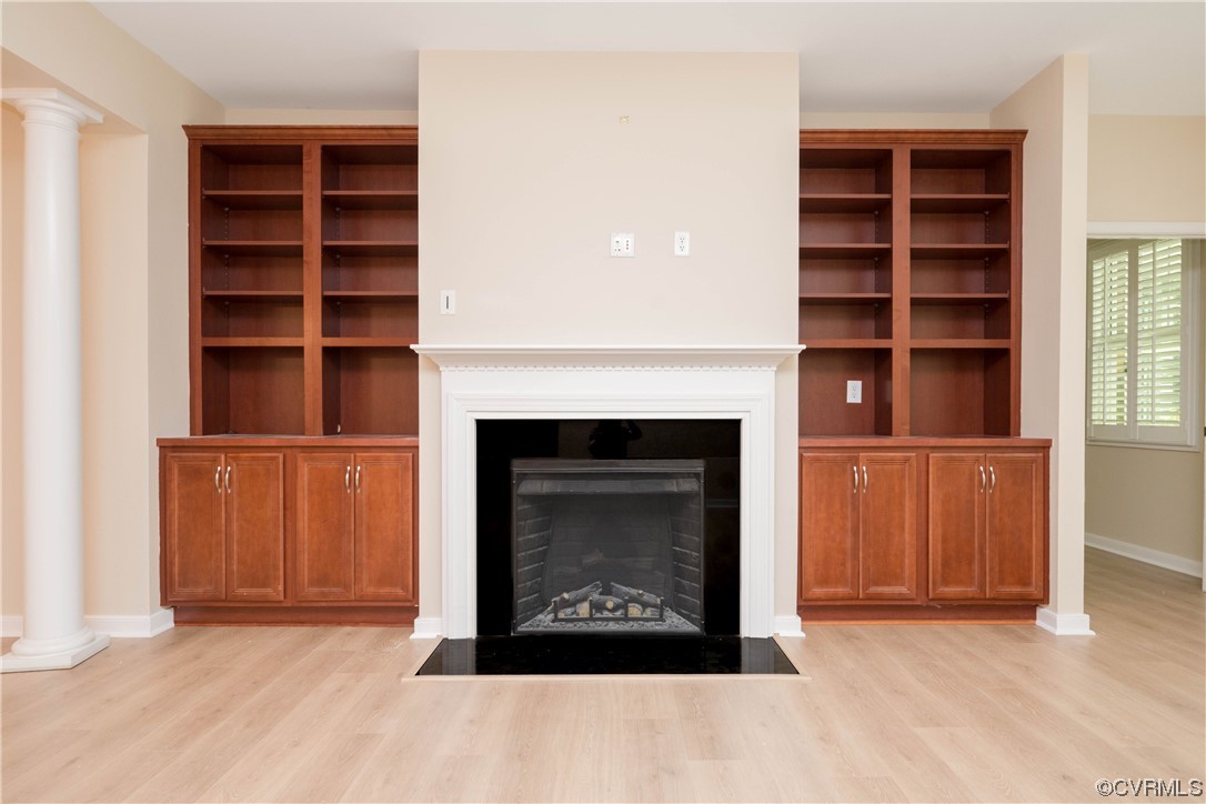 3421 Coles Point Way, Unit E Glen Allen, VA 23060 - Photo 8 of 28 a living room with a fireplace and a walk in closet