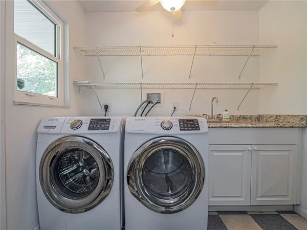 a utility room with dryer and washer
