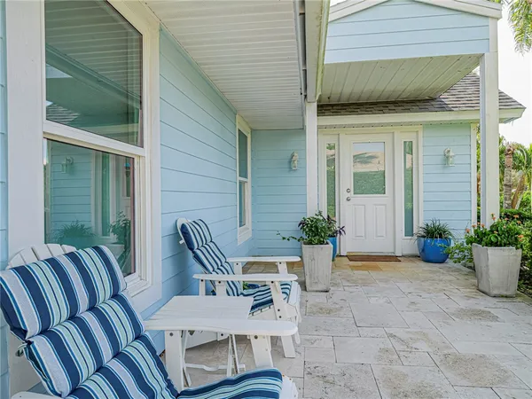 a view of two chairs in the balcony