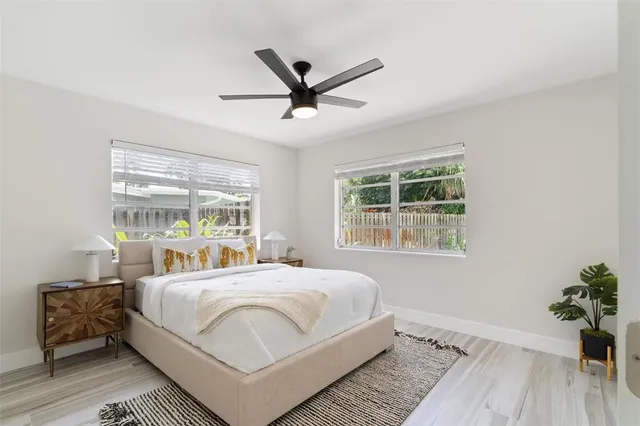 a bedroom with a large bed and a window