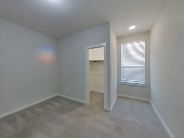 an empty room with closet area