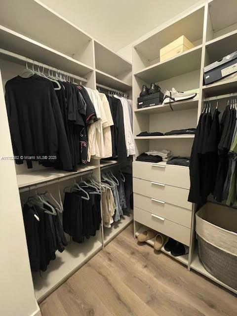 Doral Doral, FL 33178 - Photo 23 of 38 a view of walk in closet with clothes and shoes