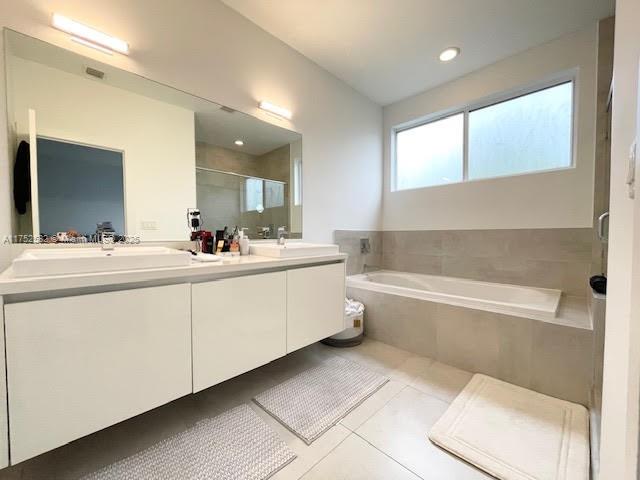 Doral Doral, FL 33178 - Photo 24 of 38 a bathroom with a double vanity sink mirror and bathtub
