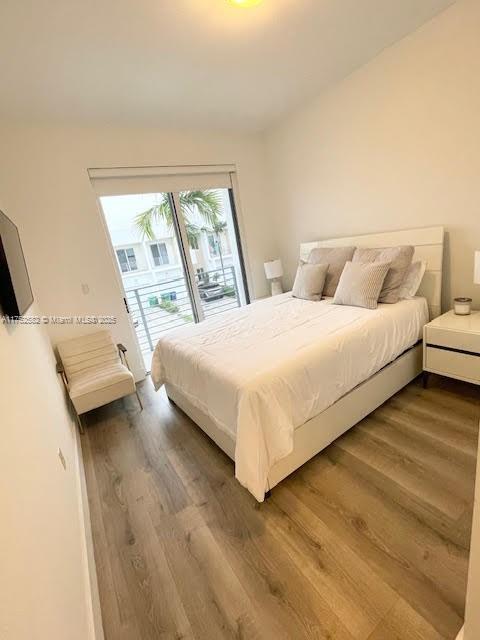 Doral Doral, FL 33178 - Photo 29 of 38 a bedroom with a bed and a large window