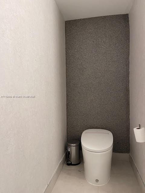 Doral Doral, FL 33178 - Photo 10 of 38 a white toilet sitting next to a white wall