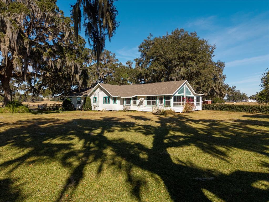 9504 Fort King Road Dade City, FL 33525 - Photo 1 of 51 a view of houses with yard