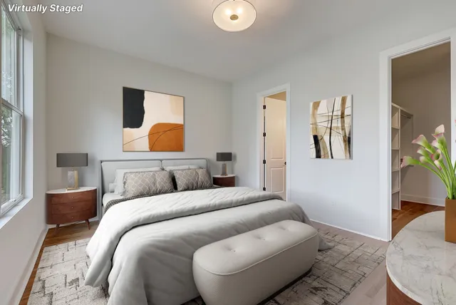 a bedroom with a bed and a couch