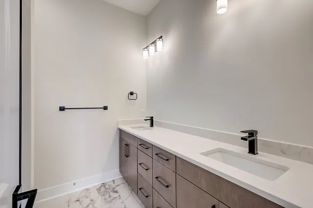 a bathroom with a sink and mirror