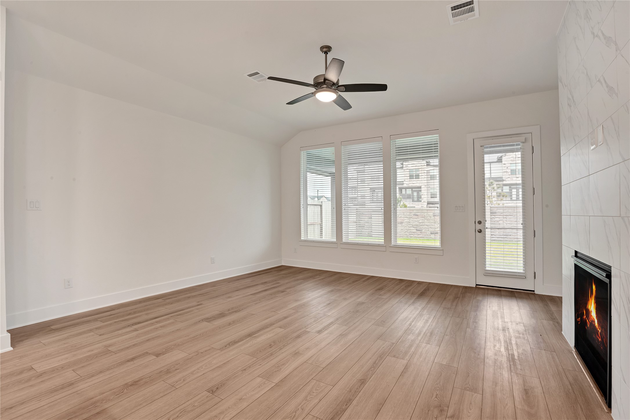 6027 Churchill Spgs Lane Fulshear, TX 77441 - Photo 12 of 25 a view of livingroom with hardwood floor and window