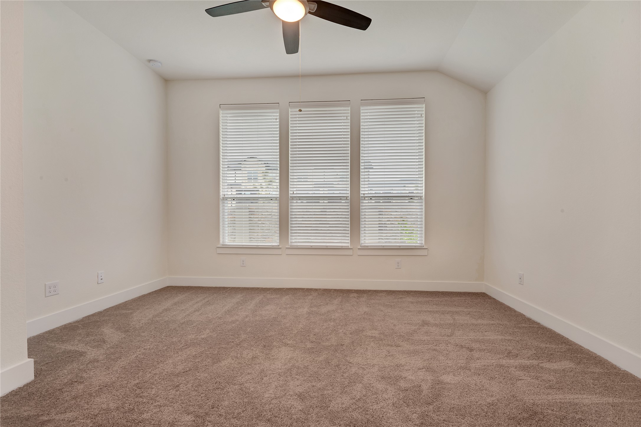 6027 Churchill Spgs Lane Fulshear, TX 77441 - Photo 16 of 25 an empty room with chandelier fan