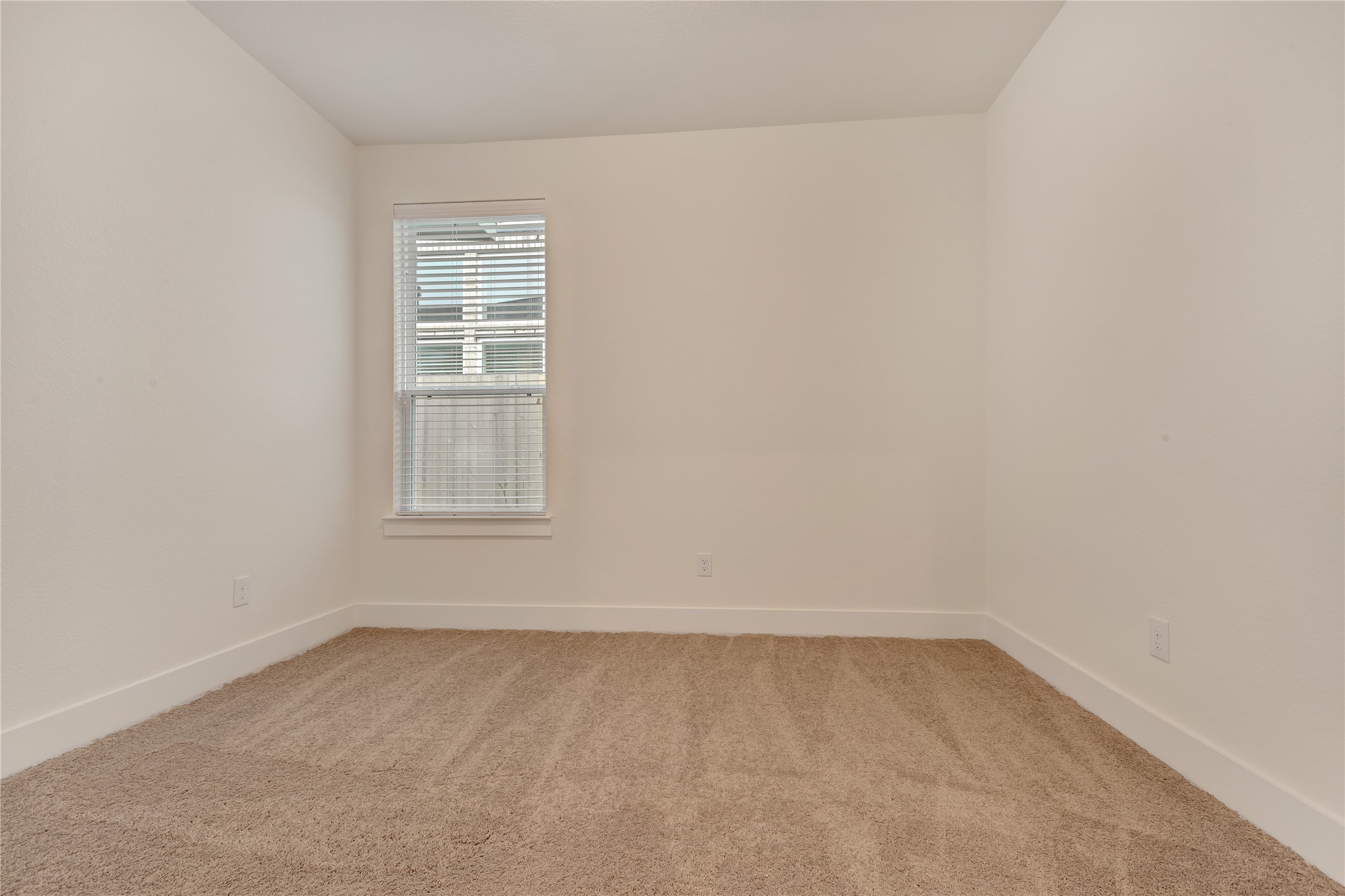 6027 Churchill Spgs Lane Fulshear, TX 77441 - Photo 20 of 25 an empty room with a window