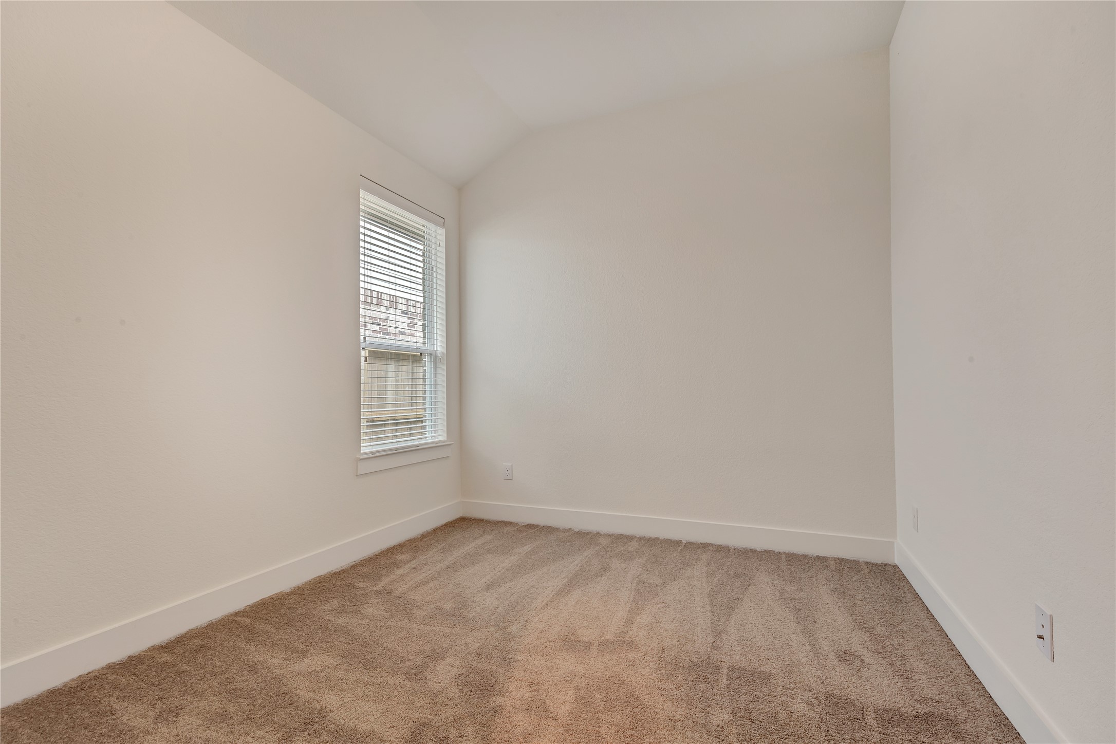 6027 Churchill Spgs Lane Fulshear, TX 77441 - Photo 22 of 25 a view of an empty room with a window