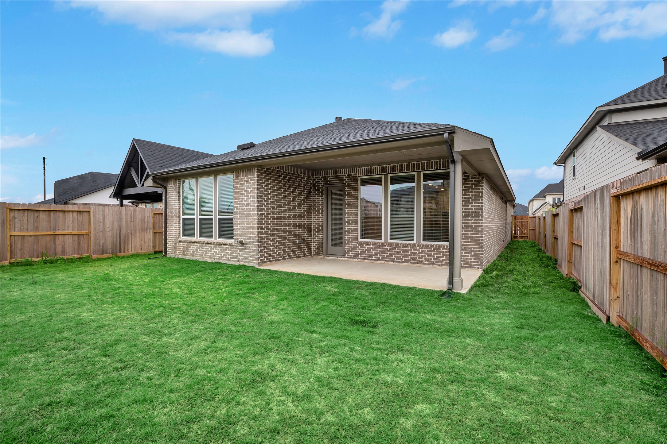 6027 Churchill Spgs Lane Fulshear, TX 77441 - Photo 24 of 25 a view of a house with backyard and garden