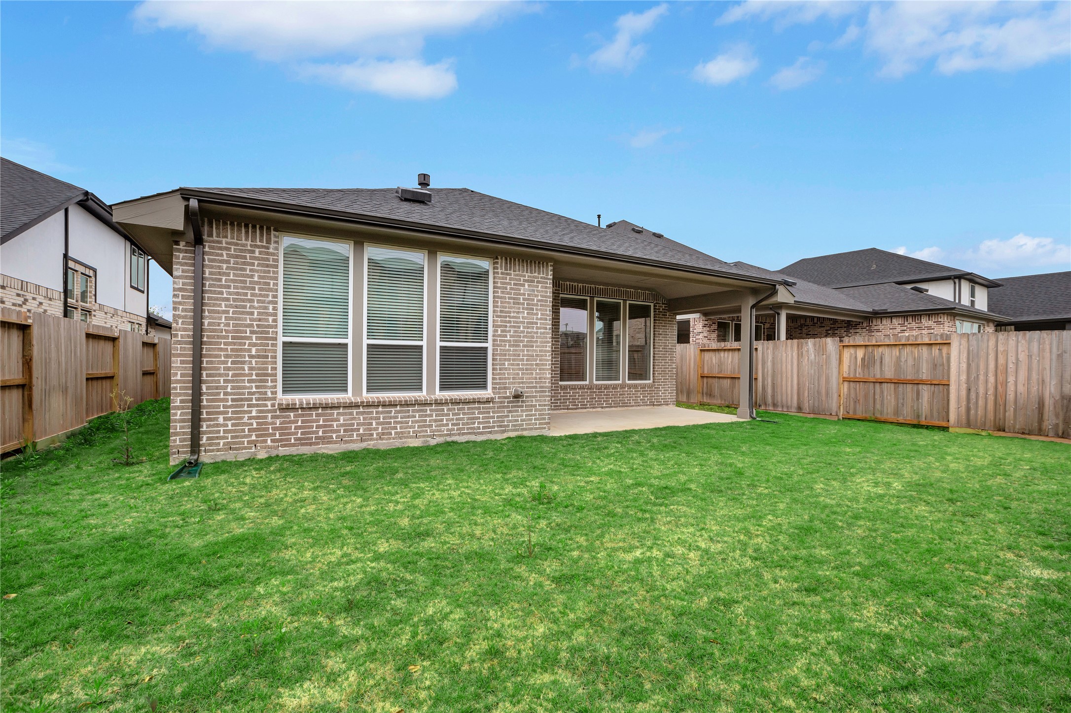 6027 Churchill Spgs Lane Fulshear, TX 77441 - Photo 25 of 25 a view of a house with a backyard