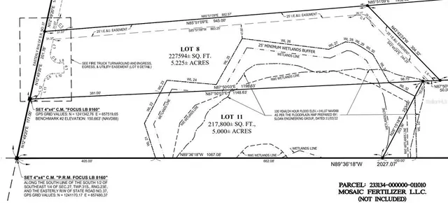 a picture of a room with a white bed and a painting on the wall