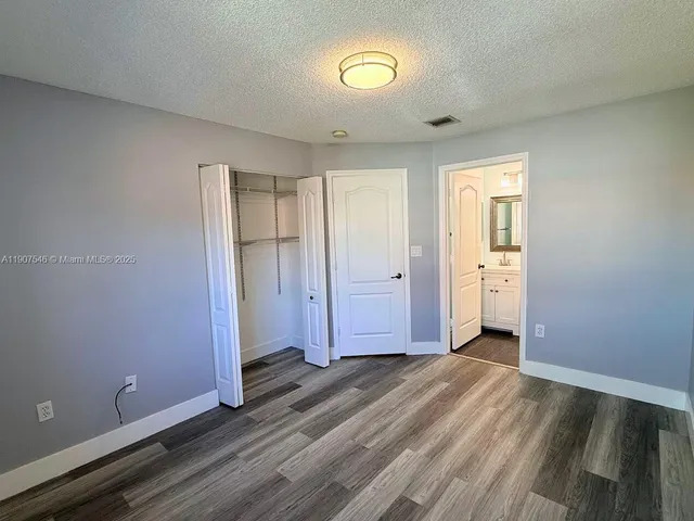 a bathroom with a sink mirror bathtub and toilet