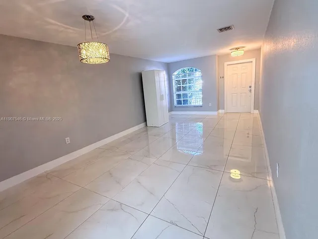 a view of a livingroom with wooden floor