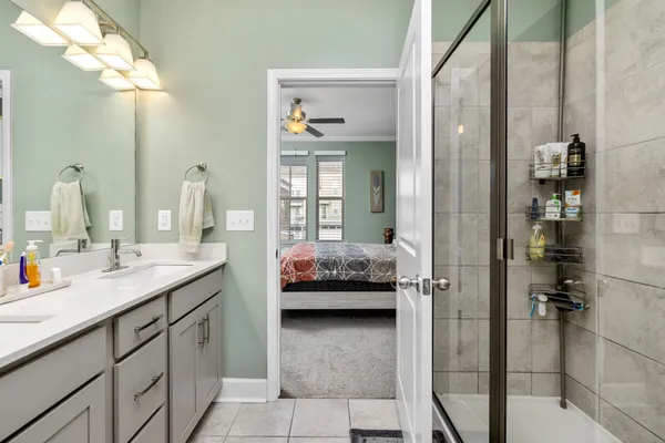a en suite bathroom with a sink and mirror