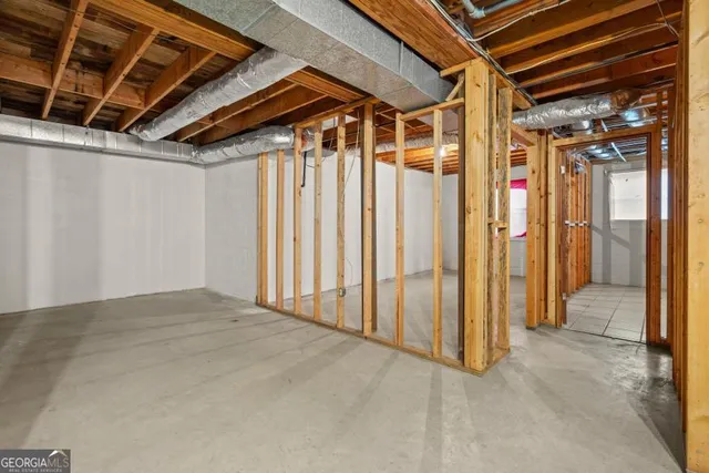 a view of a room with window and stairs