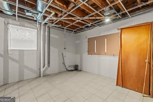 a bathroom with a granite countertop toilet and a shower