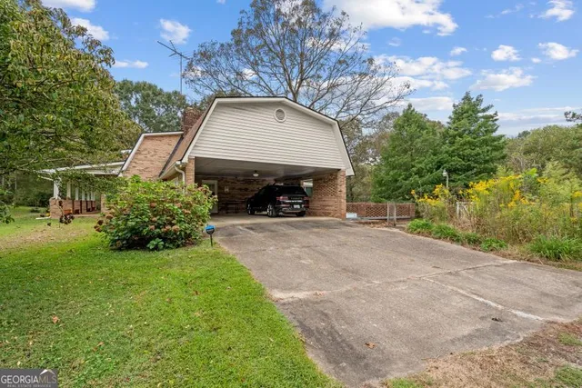 a view of a roof deck with wooden fence and floor