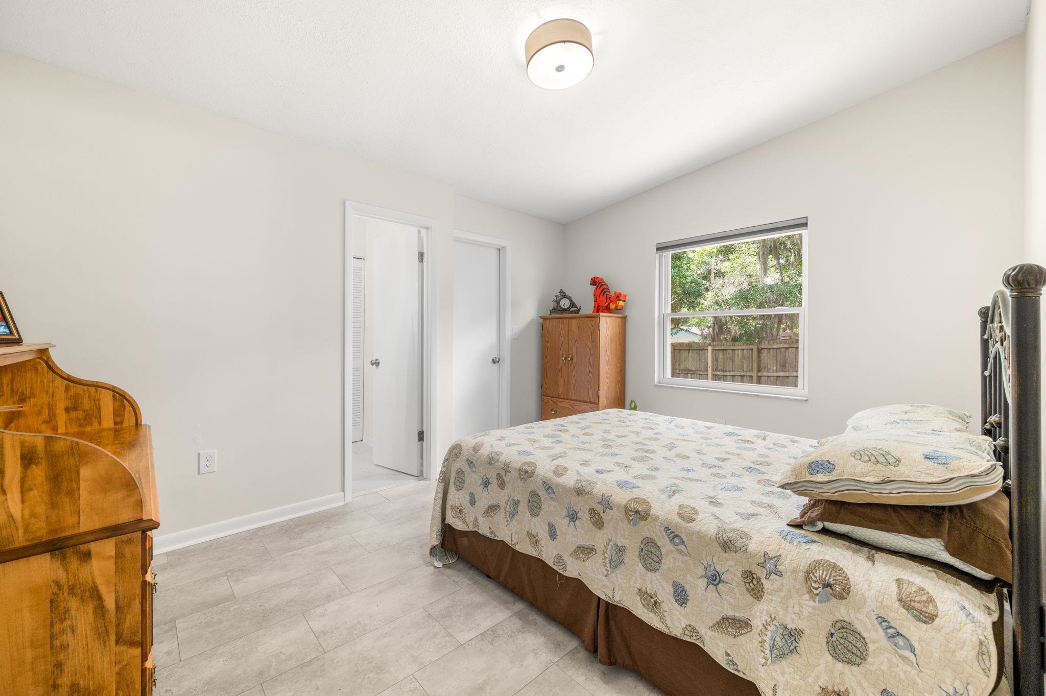 507 Gentian Road St. Augustine, FL 32086 - Photo 34 of 82 a bedroom with a bed and a window