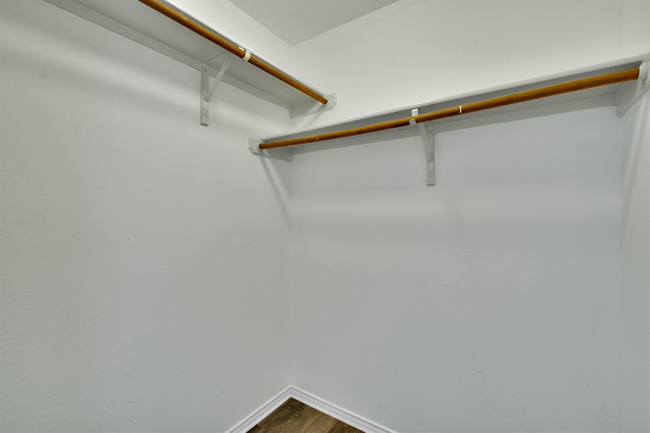 92 Verde Ranch Loop Leander, TX 78641 - Photo 14 of 37 Walk in closet featuring dark wood-style flooring