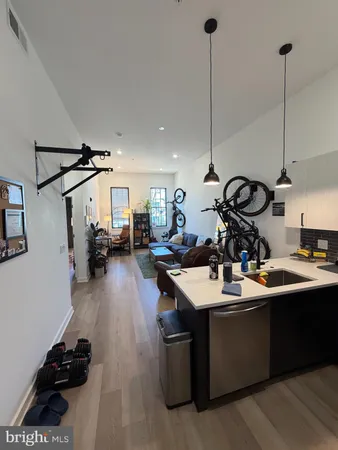 a kitchen with sink cabinets and appliances