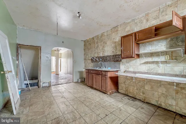 a large bathroom with a large tub and sink