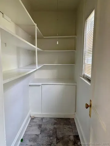 a view of storage and utility room with washer and dryer