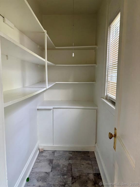 138 Mill Hill Avenue, Unit 1 Bridgeport, CT 06610 - Photo 4 of 8 a view of storage and utility room with washer and dryer