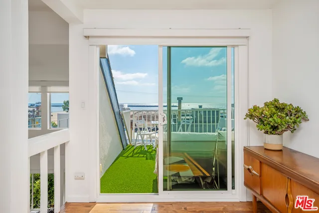 a view of a porch and garden
