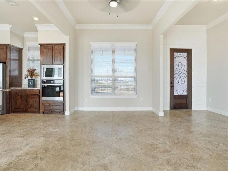 4021 West J E Woody Road Springtown, TX 76082 - Photo 5 of 37 Stepping into open concept living, dining and kitchen area