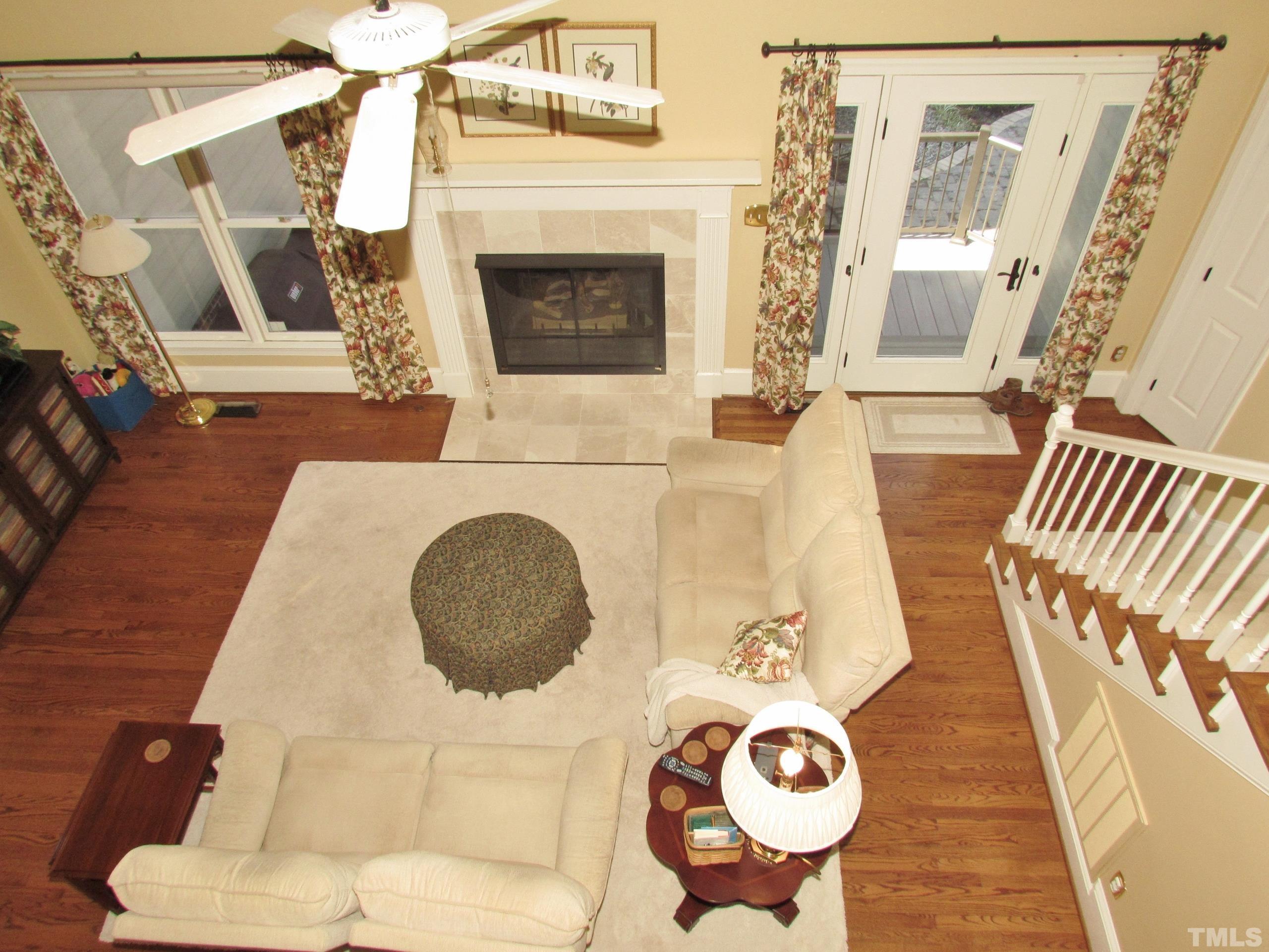 12001 Pembridge Lane Raleigh, NC 27613 - Photo 16 of 53 a living room with furniture and a fireplace