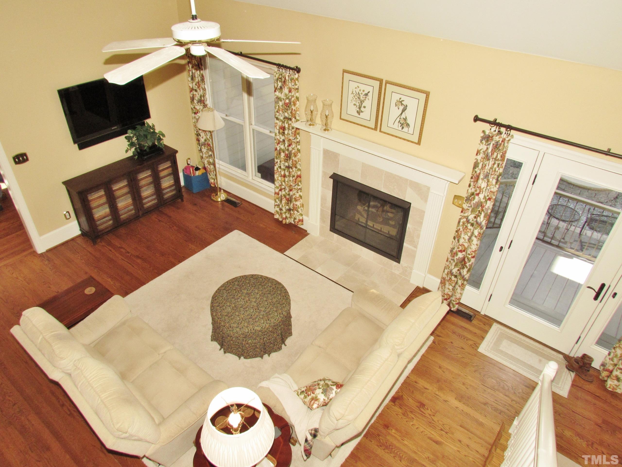 12001 Pembridge Lane Raleigh, NC 27613 - Photo 19 of 53 a view of a livingroom with furniture and a fireplace