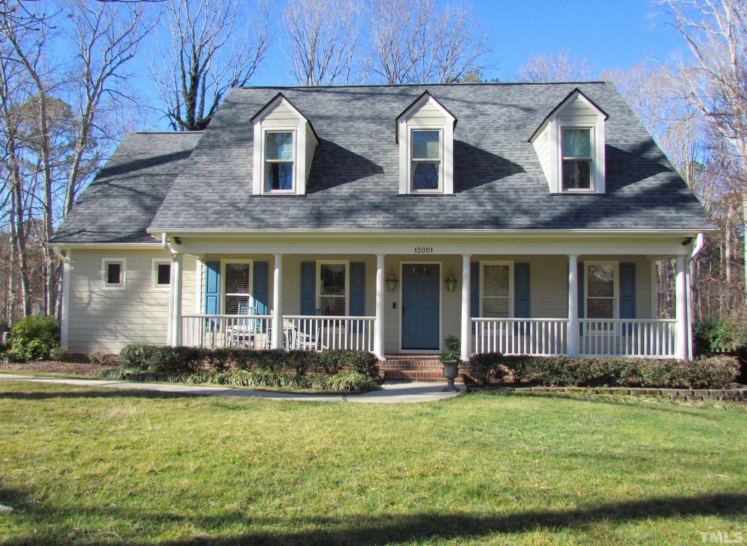 12001 Pembridge Lane Raleigh, NC 27613 - Photo 2 of 53 a front view of a house with garden