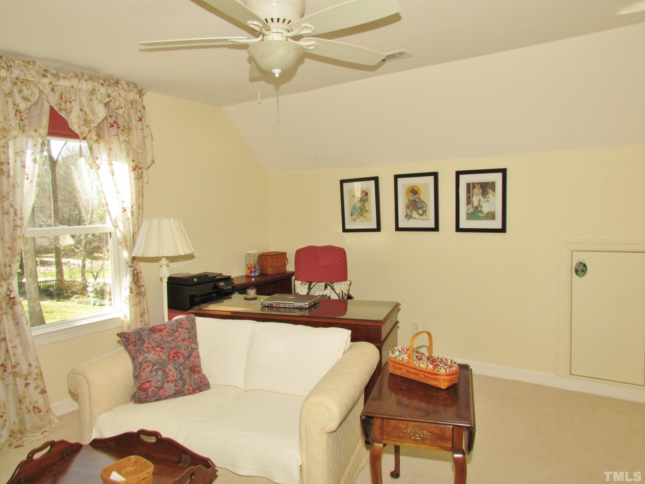 12001 Pembridge Lane Raleigh, NC 27613 - Photo 34 of 53 a living room with furniture and window